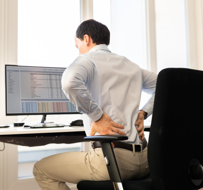 Sitting in an office chair with back pain right now? - First State Spine