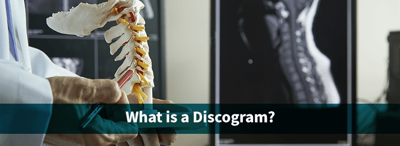 doctor with spine model explains need for discogram to patient