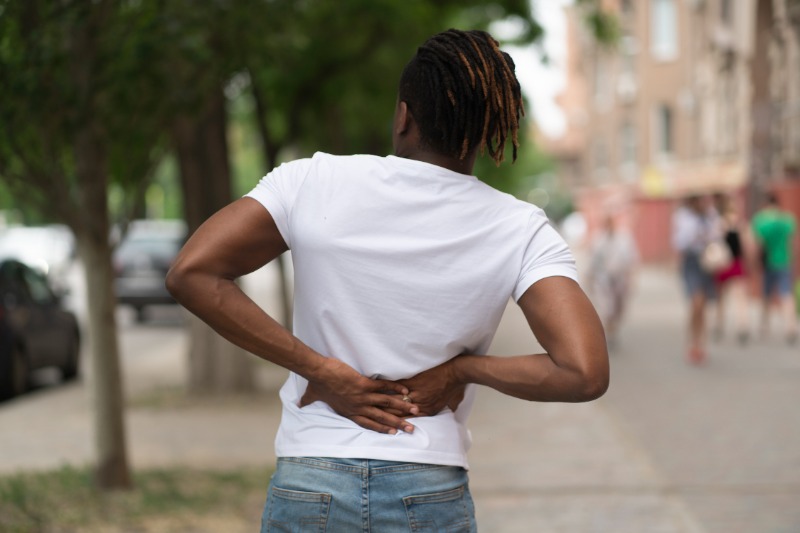 young-black-man-with-back-pain-wondering-if-it-is-a-herniated-disc-or-back-pain