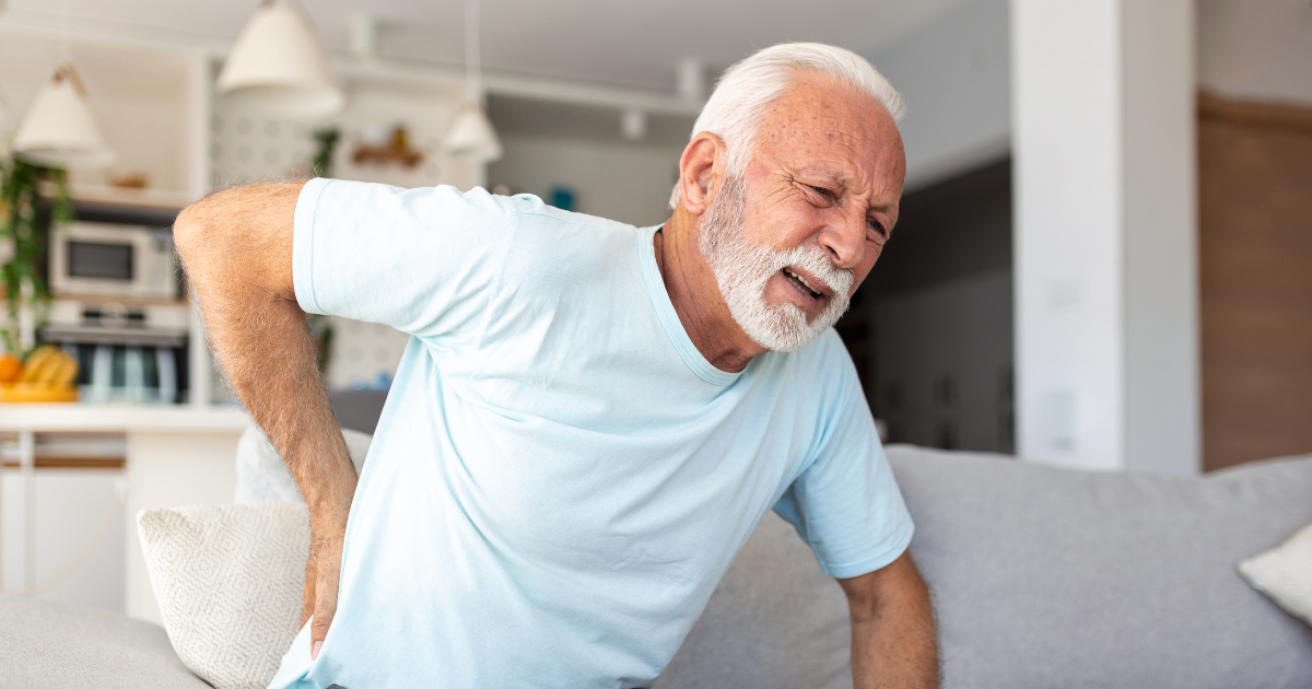 A man experiencing lower back pain in the morning.